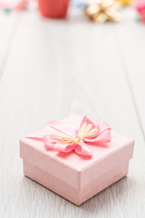 pink gift box on table wood copy space