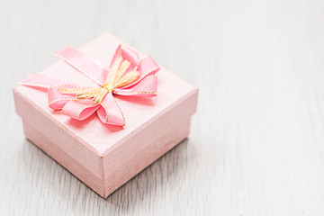 pink gift box on table wood copy space