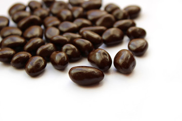 chocolate drops on white background