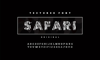 Bold with patterns, display font design, alphabet, letters and numbers. Alphabet for using, off road adventure, zoo, safari racing. © VWORLD