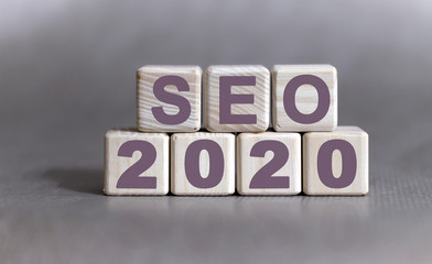 SEO 2020 text on wooden cubes on a monochrome background