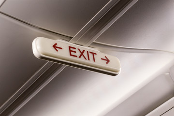 evacuation sign with the word exit on the plane