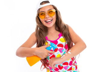 Teenager caucasian girl in glasses with cream for tanning in a spray bottle isolated on white background