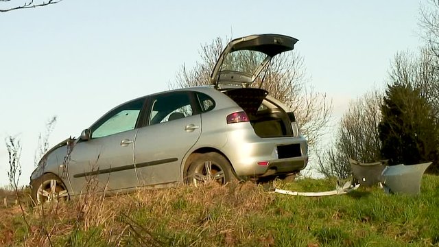 Wreck of a silver coloured car after a road traffic accident that occurred on the Oakham road in the village of Withcote in the English county of Leicestershire in the United Kingdom