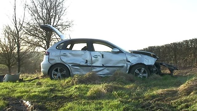 Wreck of a silver coloured car after a road traffic accident that occurred on the Oakham road in the village of Withcote in the English county of Leicestershire in the United Kingdom