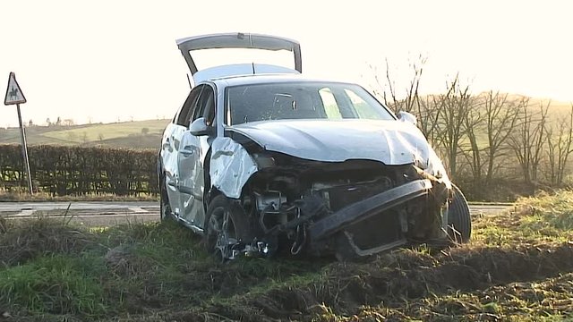 Wreck of a silver coloured car after a road traffic accident that occurred on the Oakham road in the village of Withcote in the English county of Leicestershire in the United Kingdom