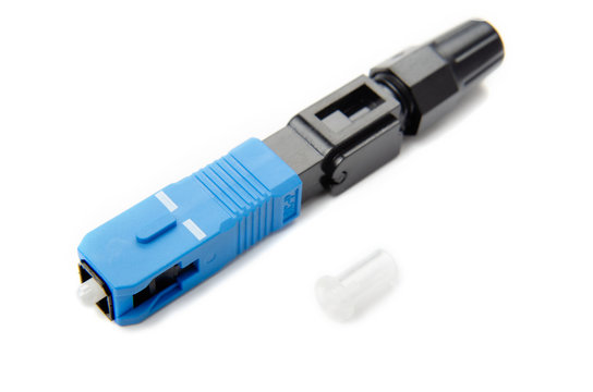 Optical SC blue connector on an isolated background close-up, for connecting to the Internet, television or local area network, GPON