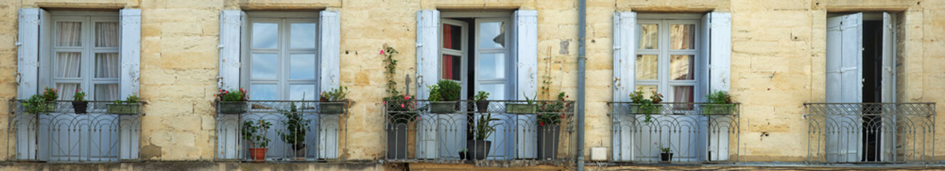 Panorama shot of rustic doors and balconies in France