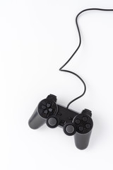 Black video game console isolated on white background with copyspace. Top view