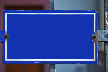 A blue colored house number plaque, without number. Mock up/ template for designers