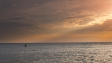 Obraz premium Small fisherman boat in the sea.