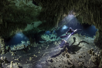 A DPV cave diver swims in the Hatzuts Aktun cenote (Mexico)