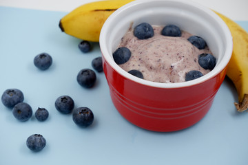 Banana nice cream with bluberries. Gluten free and dairy free healthy dessert