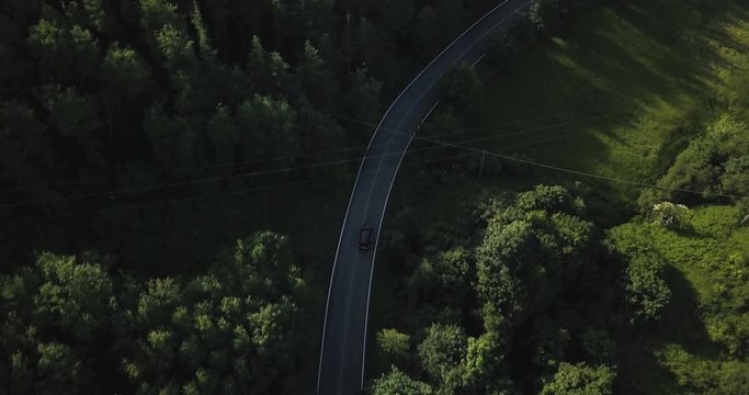 Aerial view of Mercedes driving in Passo del Giogo in Scarperia on beautiful Italian road top down shot