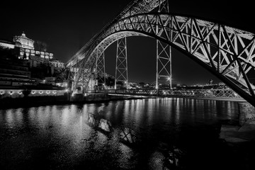 The bridge of the old city of Porto. The streets of Porto at night. Portugal. Black and white.