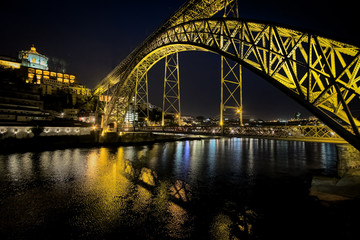 The bridge of the old city of Porto. The streets of Porto at night. Portugal.