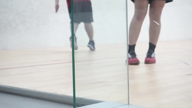 Playing squash legs moving on the floor