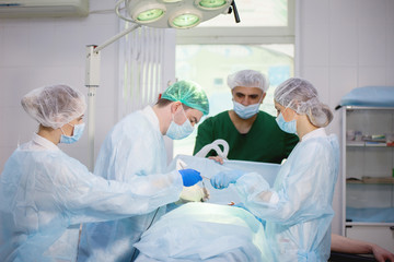 Team of surgeons doing surgery