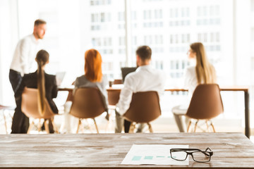 A team of young businessmen working and communicating together in an office. Corporate businessteam and manager in a meeting. blurred photo in defocus