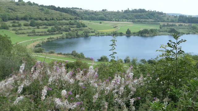 Volcanic landscape of Schalkenmehrener Maar Lake in Eifel region Germany.