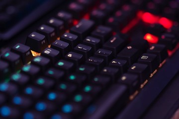 Close up of Computer RGB gaming keyboard, Illuminated by colored LED