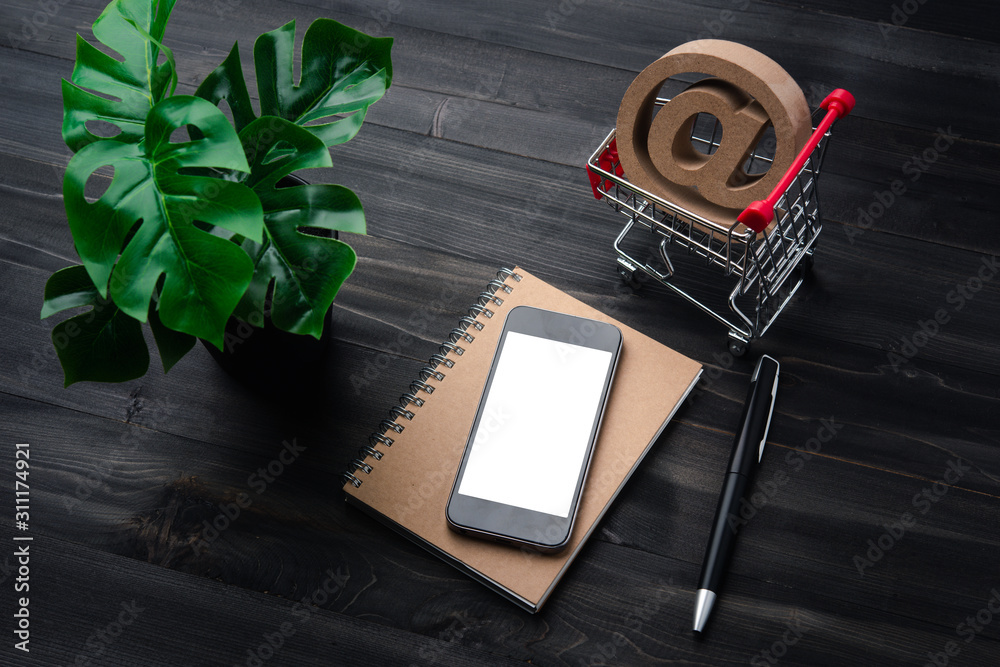 Poster creative workspace modern dark office desk with blank smartphone and pen on notebook,mockup topview