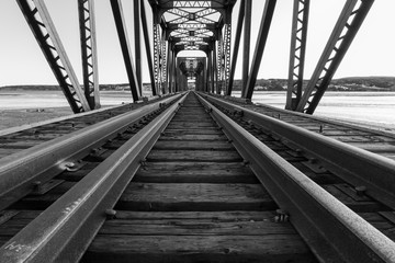 Black and white photo of railway bridge.