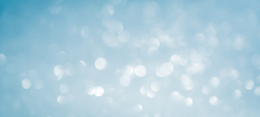 blue Abstract glitter bokeh on black background