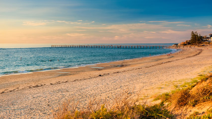 Port Noarlunga south beach coastline with people at sunset