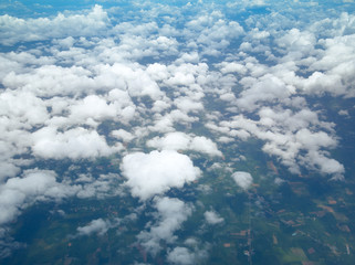 Aerial view of cloudscape with blue sky,  Clouds from above.  A view from airplane.