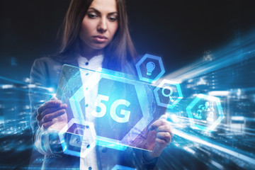 Business, Technology, Internet and network concept. Young businessman working on a virtual screen of the future and sees the inscription: 5G
