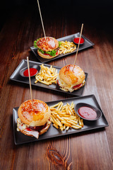 Close-up of home made burgers on wooden background