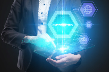 Business, Technology, Internet and network concept. Young businessman working on a virtual screen of the future and sees the inscription: Remarketing