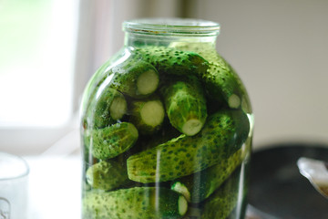 glass jar of green pickles