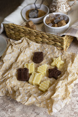 Christmas sweets: candy in the form of a Christmas tree and gifts on craft paper