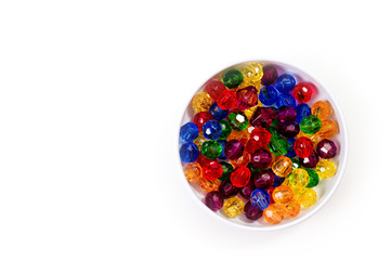 Multi-colored glass beads for beads and bracelets shot large on a white background