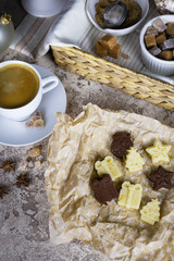 Christmas sweets: candy in the form of a Christmas tree and gifts on craft paper