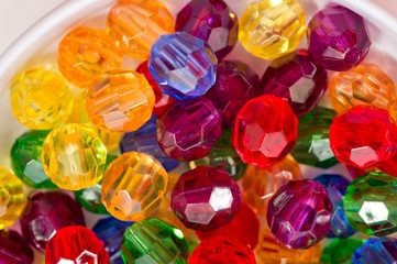 Multi-colored glass beads for beads and bracelets shot large on a white background