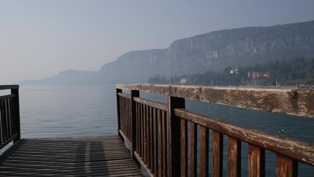 Wooden Pier on Garda Lake, Italy. Panoramic Walkthrough.