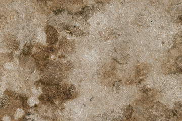 The old particle board surface with stains is exposed to moisture. Abstract particle wood  texture background