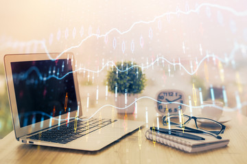 Forex Chart hologram on table with computer background. Multi exposure. Concept of financial markets.