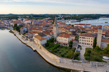 Fototapeta na wymiar Fragment of the waterfront of the old city close-up. Porec, Croatia. Shooting from a drone.