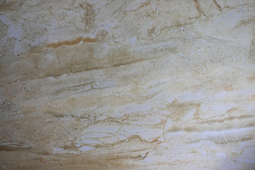 Obraz na płótnie Canvas Texture for designers natural marble stone. Background of yellow glossy stone. Abstract stone concept with.