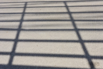 The shadow of car grille apper on the street. © meesilpa sornsing