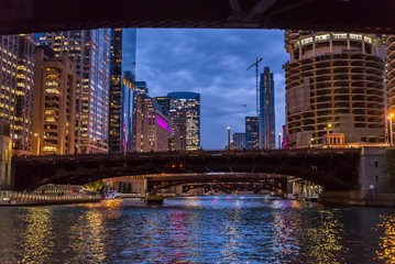 Marina City and Buildings along the river Chicago illuminated at night, Chicago, Illinois, USA
