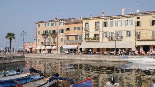 People and Tourists on Lake Walk in Lasize, Garda Lake, Italy.