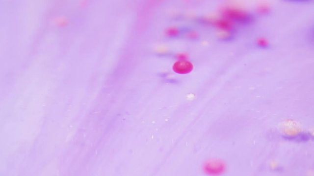 Bright collors bubbles moves in slow motion in oil with acrylic