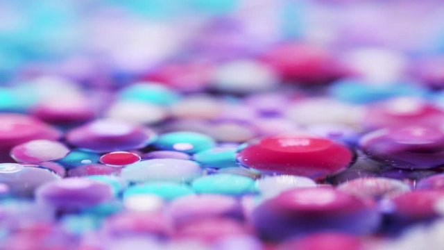 Bright collors bubbles moves in slow motion in oil with acrylic