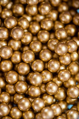Close up shot of gold colored balls