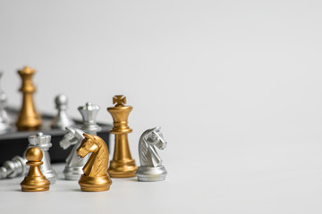Chess leadership concept with gold and silver chess isolated in white background. Concept leader & success, strategy, business victory or decision